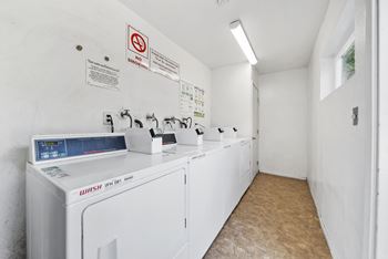 A laundry room with a washer and dryer.